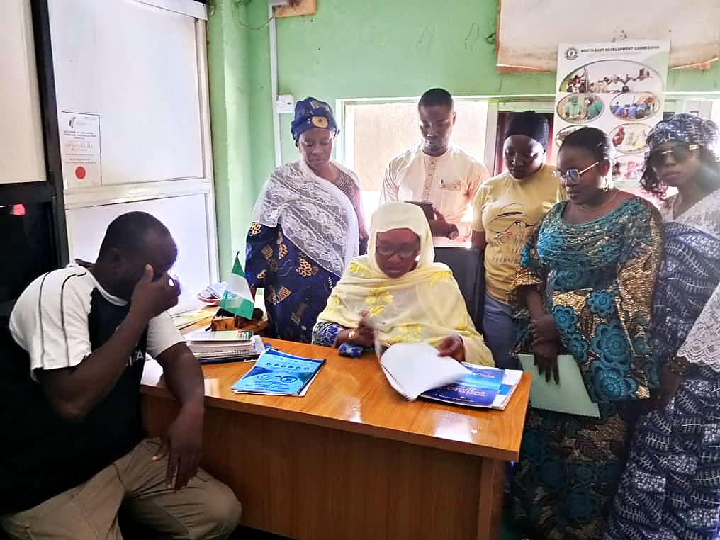 Consortium partners reviewing the signed agreement documents
