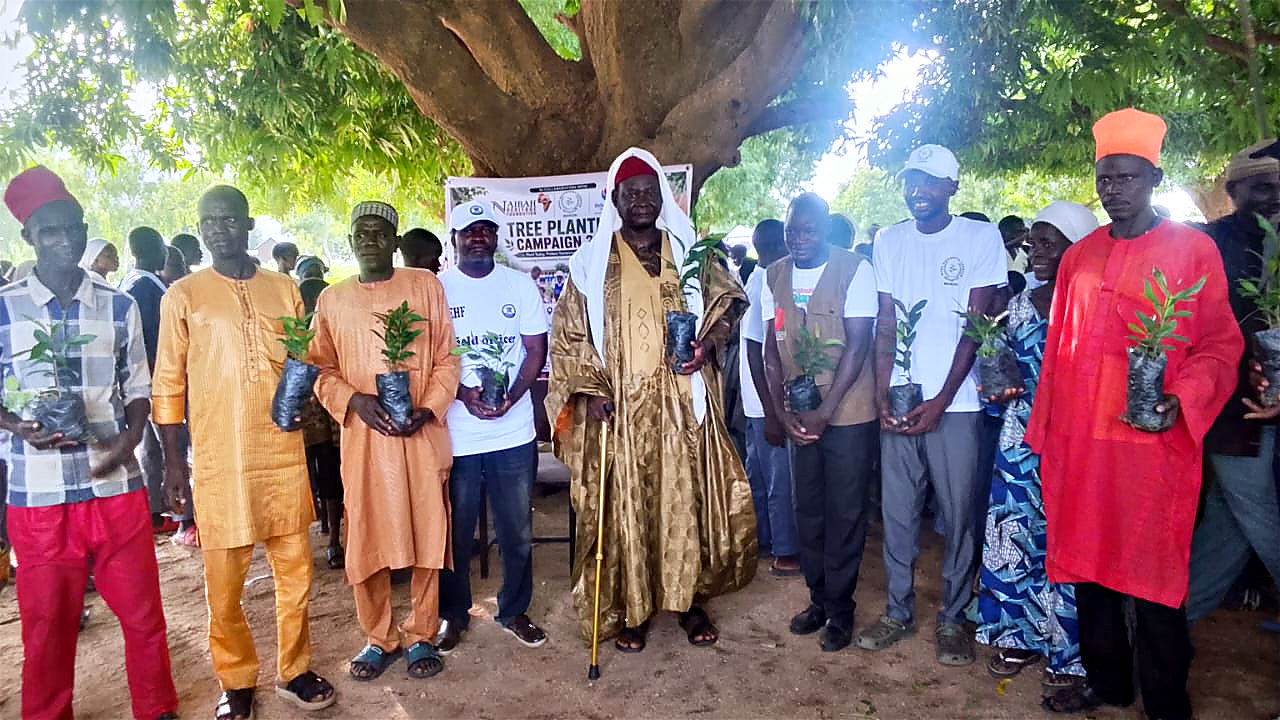 Community leaders and the district head receiving tree seedlings during the 2026 Tree Planting Campaign in Madagali LGA