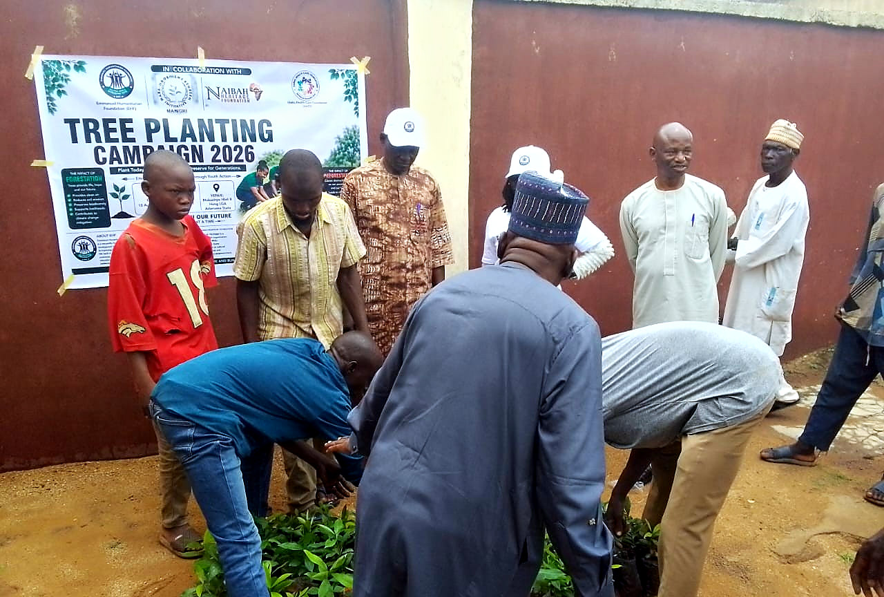 Seedling distribution beneath the Tree Planting Campaign 2026 banner in Mukuvinye Hlidi B, Hong LGA